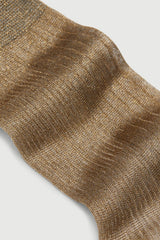 Close-up of a brown textured sock on a light gray background