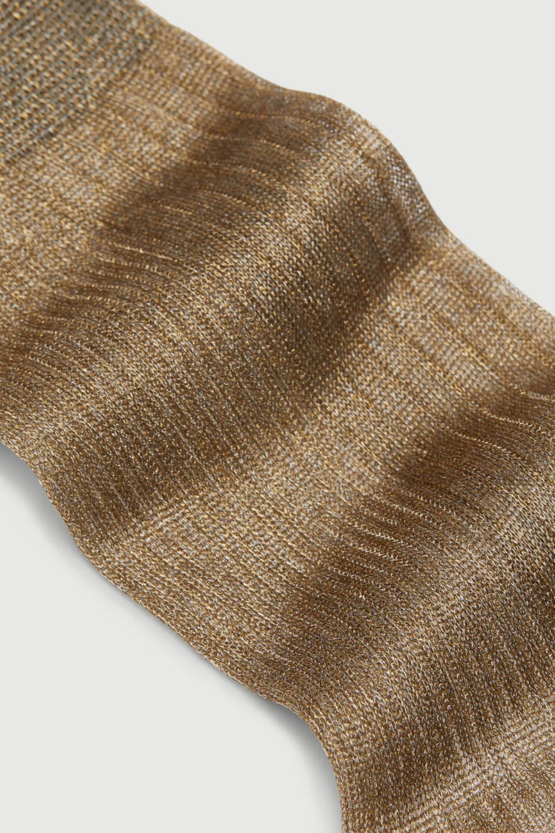 Close-up of a brown textured sock on a light gray background