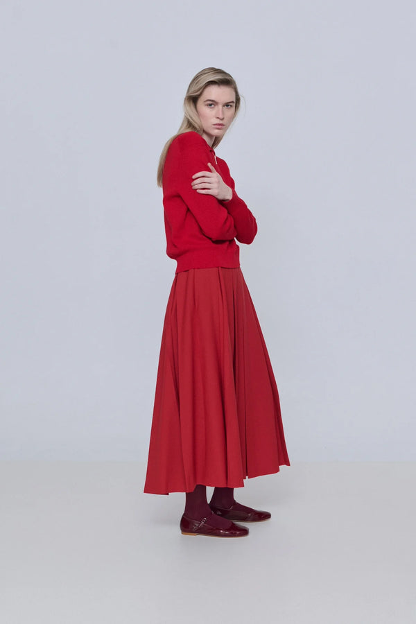 Woman wearing a red outfit on a white background