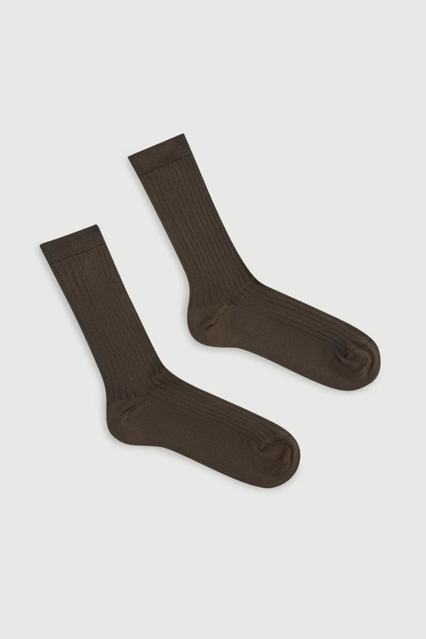 Pair of brown socks on a light gray background