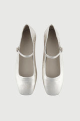 Pair of silver high heels on a light gray background