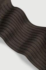 Close-up of brown textured fabric on a light gray background