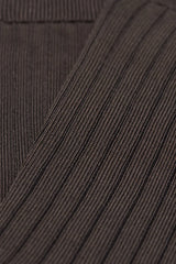 Close-up of brown textured fabric with a focus on texture and pattern.