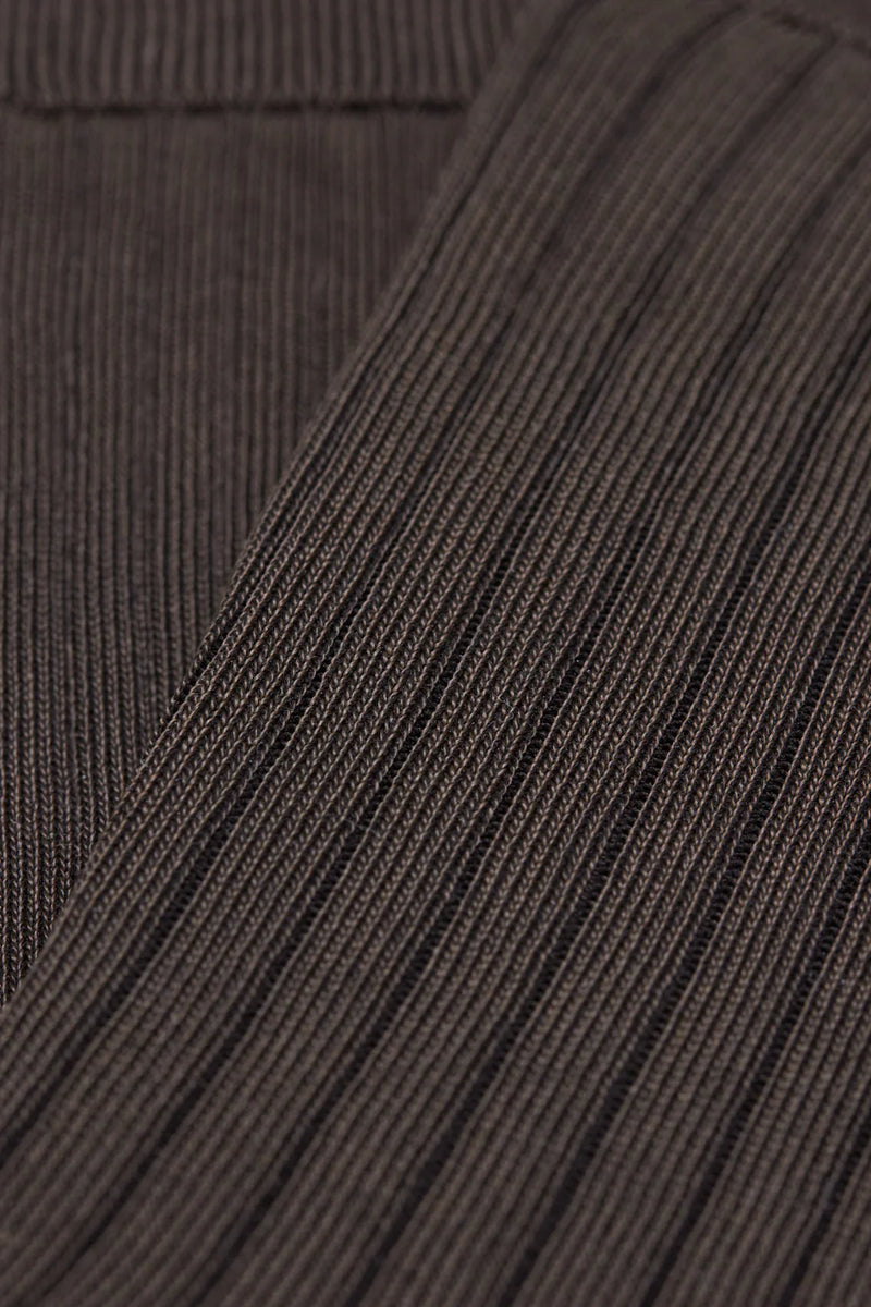Close-up of brown textured fabric with a focus on texture and pattern.