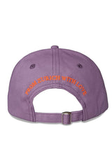 Purple cap with 'From Zurich with Love' text on a white background