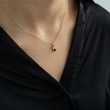 Checker Pendant Black in Gold