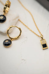 Checker Pendant Black in Gold