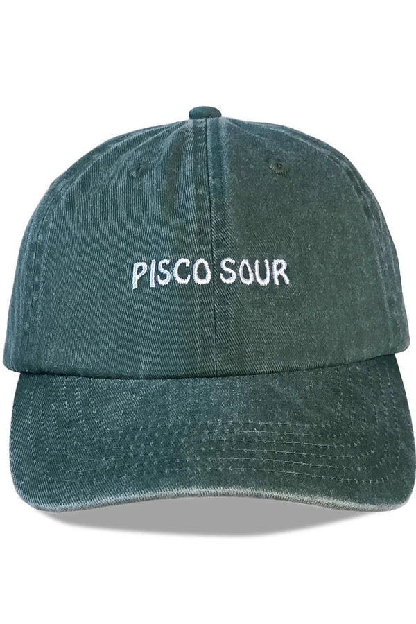 Green denim cap with 'Pisco Sour' text on a white background